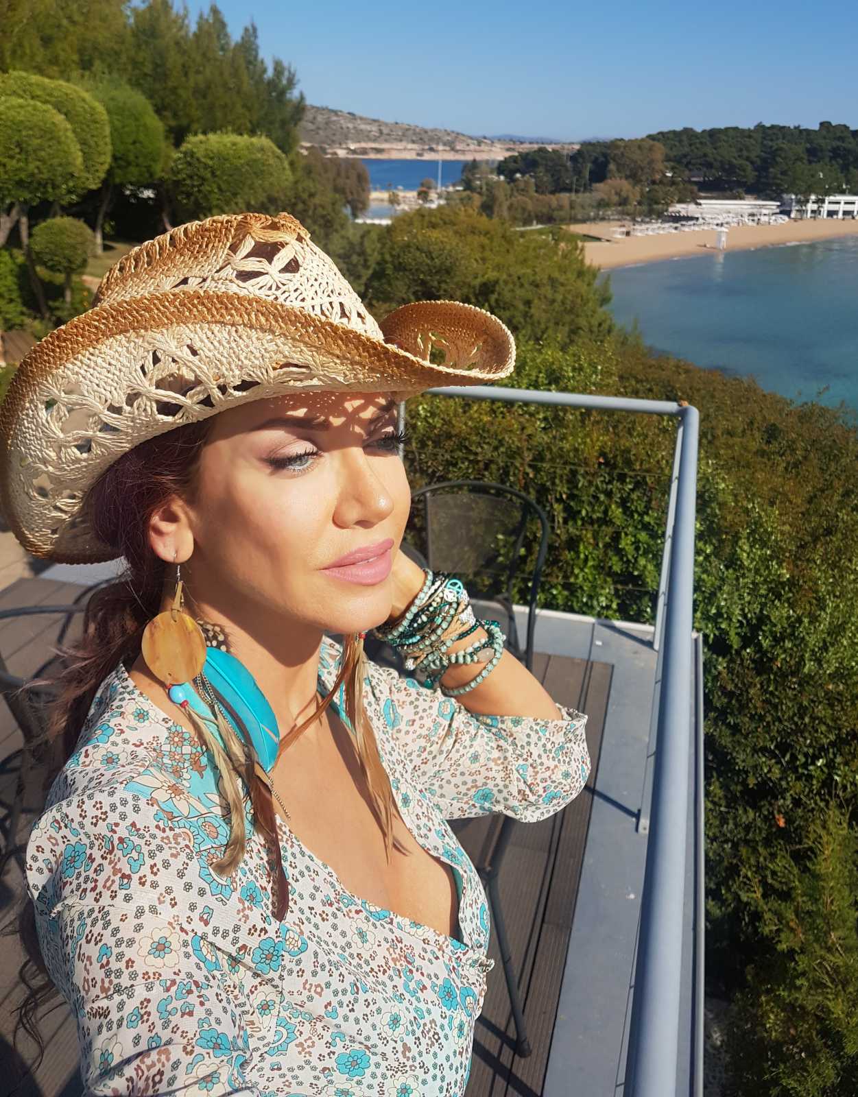 Crochet cowboy hat and turquoise jewellery by the Athens coast